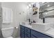 Modern bathroom with double sinks, blue vanity, and stylish fixtures, creating a luxurious feel at 306 Salt Marsh Circle # 5A, Pawleys Island, SC 29585