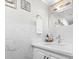 Elegant bathroom with marble countertop, modern fixtures, and a decorative mirror at 306 Salt Marsh Circle # 5A, Pawleys Island, SC 29585
