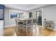 Cozy breakfast nook adjacent to outdoor deck with light wood floors and seating for four at 306 Salt Marsh Circle # 5A, Pawleys Island, SC 29585