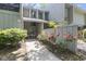 Charming exterior of townhome unit with covered porch and landscaped front yard at 306 Salt Marsh Circle # 5A, Pawleys Island, SC 29585