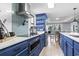 Modern kitchen with light blue cabinetry, stainless appliances, and ample counter space at 306 Salt Marsh Circle # 5A, Pawleys Island, SC 29585