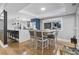 Open concept kitchen with island, stainless steel appliances, and dining area at 306 Salt Marsh Circle # 5A, Pawleys Island, SC 29585