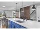 Stylish kitchen features a large island, stainless steel appliances, and wood accent wall at 306 Salt Marsh Circle # 5A, Pawleys Island, SC 29585