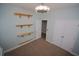 Bedroom with carpeted floors, natural-light window, double door closet, and custom shelving at 306 Southgate Ct., Pawleys Island, SC 29585