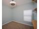 Bright bedroom features carpeted floors, large window, modern ceiling fan and custom shelving at 306 Southgate Ct., Pawleys Island, SC 29585