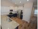 Modern kitchen with granite counters, stainless steel appliances, and white subway tile backsplash at 306 Southgate Ct., Pawleys Island, SC 29585