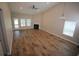 Bright living room with hardwood floors, a fireplace, and large windows offering plenty of natural light at 306 Southgate Ct., Pawleys Island, SC 29585