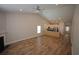 Open-concept living area with hardwood floors, a kitchen island, and ample natural light at 306 Southgate Ct., Pawleys Island, SC 29585