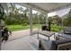 Inviting screened porch with comfortable seating, ideal for enjoying the serene backyard view at 306 Southgate Ct., Pawleys Island, SC 29585