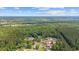 Scenic aerial view of a neighborhood featuring charming homes surrounded by vibrant green trees and blue skies at 3565 Steamer Trace Rd., Conway, SC 29527