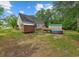 An expansive backyard with a well-maintained lawn, above-ground pool, outbuilding, and storage shed at 3565 Steamer Trace Rd., Conway, SC 29527