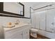 Bathroom with tiled shower, white vanity, and classic fixtures at 3565 Steamer Trace Rd., Conway, SC 29527