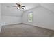 Bright bedroom with carpet flooring, a ceiling fan, and a window that fills the space with natural light at 3565 Steamer Trace Rd., Conway, SC 29527
