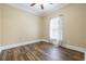 Cozy bedroom featuring a ceiling fan, window with blinds, and wood-look laminate flooring at 3565 Steamer Trace Rd., Conway, SC 29527