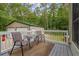 Relaxing deck with outdoor seating, and a view of the lush backyard and outbuilding at 3565 Steamer Trace Rd., Conway, SC 29527