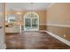 Dining room with hardwood floors, modern lighting, and bright, natural light at 3565 Steamer Trace Rd., Conway, SC 29527