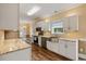 Beautiful kitchen features stainless steel appliances, white cabinets, and hardwood floors at 3565 Steamer Trace Rd., Conway, SC 29527