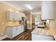 Well-equipped kitchen features stainless steel appliances, stone countertops, and hardwood floors at 3565 Steamer Trace Rd., Conway, SC 29527
