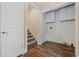 A well-organized laundry room with white cabinets, washer/dryer hookups, and stairs leading to another floor at 3565 Steamer Trace Rd., Conway, SC 29527