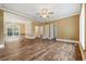 Spacious living room with hardwood floors, modern lighting, and neutral paint colors at 3565 Steamer Trace Rd., Conway, SC 29527