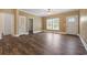 Bright living room boasts hardwood floors, a ceiling fan, and a view of the front yard at 3565 Steamer Trace Rd., Conway, SC 29527