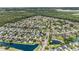 Wide aerial view of a planned community featuring many single-Gathering homes, ponds, and lush greenery at 3605 Kingsley Dr., Myrtle Beach, SC 29588