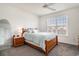 Cozy bedroom with carpet, ceiling fan, large window, and lots of natural light at 3605 Kingsley Dr., Myrtle Beach, SC 29588