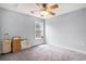 Cozy bedroom featuring neutral walls, a ceiling fan, and a window at 3605 Kingsley Dr., Myrtle Beach, SC 29588
