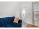 Inviting entryway with a decorative door, tile flooring, and a blue sofa at 3605 Kingsley Dr., Myrtle Beach, SC 29588