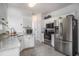 Kitchen boasts stainless appliances, granite counters, tile flooring, and ample white cabinetry at 3605 Kingsley Dr., Myrtle Beach, SC 29588