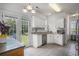 Bright kitchen features stainless steel appliances, white cabinets, and granite countertops at 3605 Kingsley Dr., Myrtle Beach, SC 29588