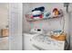 Well-organized laundry room with washer, dryer, and shelving for storage at 3605 Kingsley Dr., Myrtle Beach, SC 29588