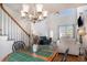 Open-concept living area with high ceilings, hardwood floors, and staircase to the second level at 3605 Kingsley Dr., Myrtle Beach, SC 29588