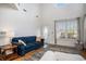 Inviting living room featuring hardwood floors, a blue sofa, and a window at 3605 Kingsley Dr., Myrtle Beach, SC 29588