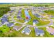 Aerial view of a residential community featuring single-Gathering homes surrounding a scenic pond and cul-de-sac at 364 Copperwood Loop, Conway, SC 29526