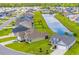 Aerial view of homes in a community alongside a pond, showcasing the neighborhood's layout and green spaces at 364 Copperwood Loop, Conway, SC 29526