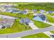 Aerial view of a neighborhood featuring single-Gathering homes, well-kept lawns, and a community pond at 364 Copperwood Loop, Conway, SC 29526