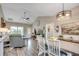 Bright and open dining area with vaulted ceiling, seamlessly connected to the living room and kitchen at 364 Copperwood Loop, Conway, SC 29526
