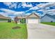 Beautifully landscaped home with a two-car garage, green lawn, and inviting curb appeal at 364 Copperwood Loop, Conway, SC 29526