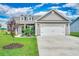 Charming single-story home featuring a two-car garage, well-manicured lawn, and inviting curb appeal at 364 Copperwood Loop, Conway, SC 29526