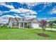 Attractive home with a well-kept lawn, flowering trees, and a spacious two-car garage at 364 Copperwood Loop, Conway, SC 29526