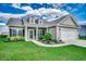 Charming single-story home with well-manicured lawn, landscaped garden, and inviting covered entryway at 364 Copperwood Loop, Conway, SC 29526