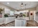 Modern kitchen featuring white cabinets, granite countertops, stainless steel appliances, and contemporary lighting at 364 Copperwood Loop, Conway, SC 29526