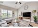 Bright living room featuring a vaulted ceiling, wood-look flooring, and contemporary decor at 364 Copperwood Loop, Conway, SC 29526