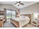Bright primary bedroom with a vaulted ceiling, plush carpet, and a large window with backyard views at 364 Copperwood Loop, Conway, SC 29526