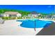 Inviting community pool with ample seating and well-maintained landscaping and surrounding homes at 364 Copperwood Loop, Conway, SC 29526