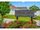 Elegant community sign amidst lush landscaping and vibrant flowers, setting a welcoming tone at 364 Copperwood Loop, Conway, SC 29526
