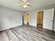 Large bedroom with wood-look floors, ceiling fan and doors to the bathroom and hallway provide easy access at 3786 Hitchcock Way # 321, Myrtle Beach, SC 29577
