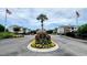 View of the community entrance with flowers and the community sign at 3786 Hitchcock Way # 321, Myrtle Beach, SC 29577