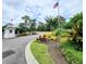 View of the community entrance with landscaping, guard shack and US flag at 3786 Hitchcock Way # 321, Myrtle Beach, SC 29577